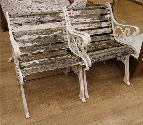 A pair of cast iron frame garden seats